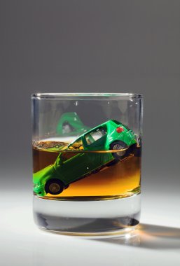 Car keys and glass with alcohol clipart