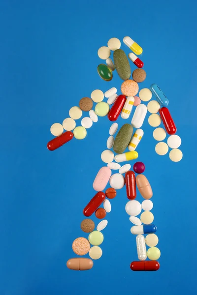 stock image Man silhouette made from colorfull variable pills.