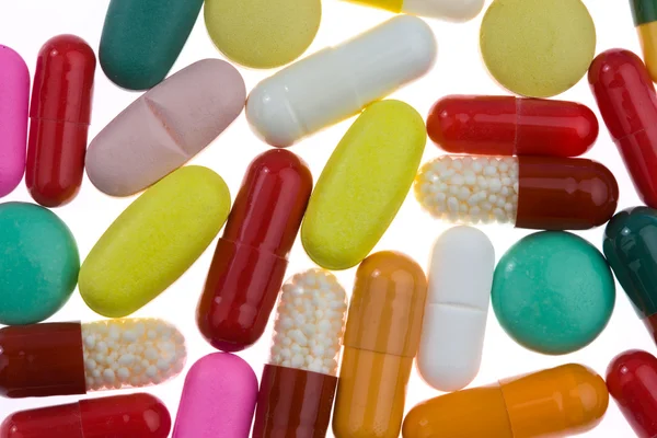 Viele verschiedene farbige Tabletten — Stockfoto