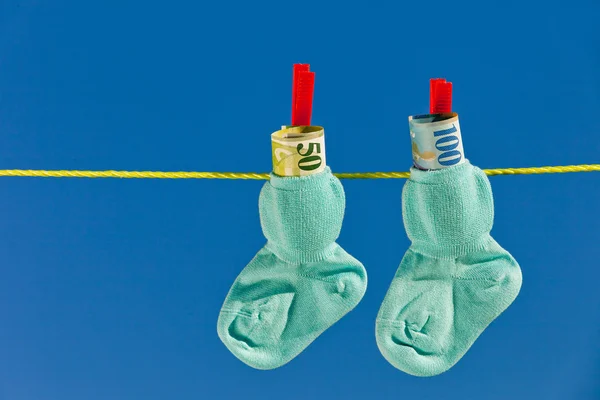Baby socks with swiss francs — Stock Photo, Image