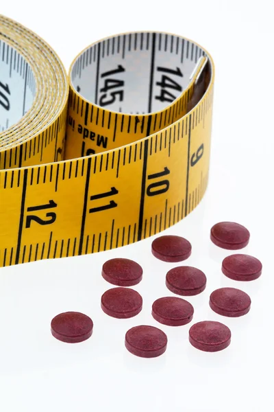 Fita métrica e comprimidos — Fotografia de Stock