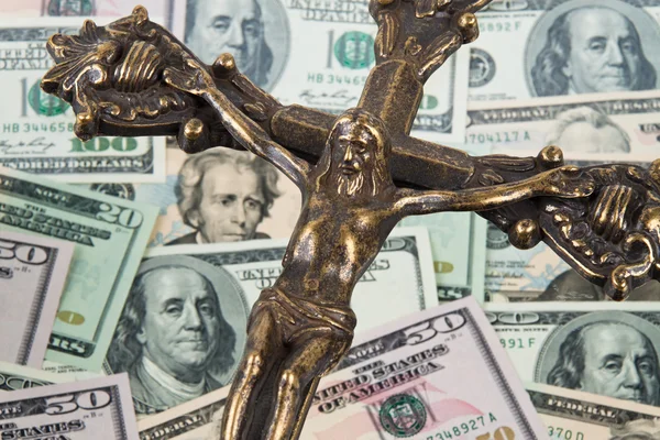 Dollar currency notes and cross — Stock Photo, Image