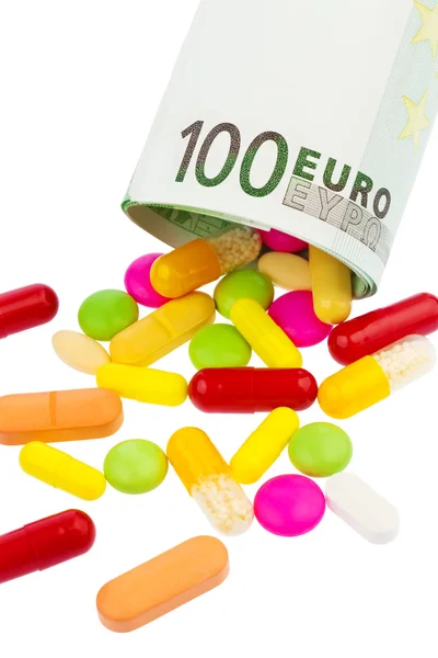 Tabletas y billete de 100 euros — Foto de Stock