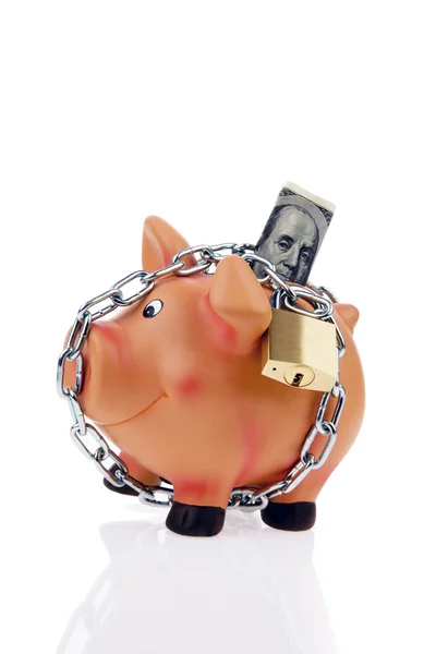 Piggy bank pénzt lánc és a dollár — Stock Fotó