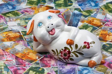 Swiss franc and piggy bank clipart