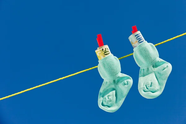 Baby socks with swiss francs — Stock Photo, Image