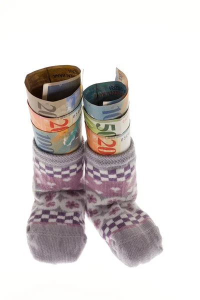 Dětské ponožky ve švýcarských francích — Stock fotografie