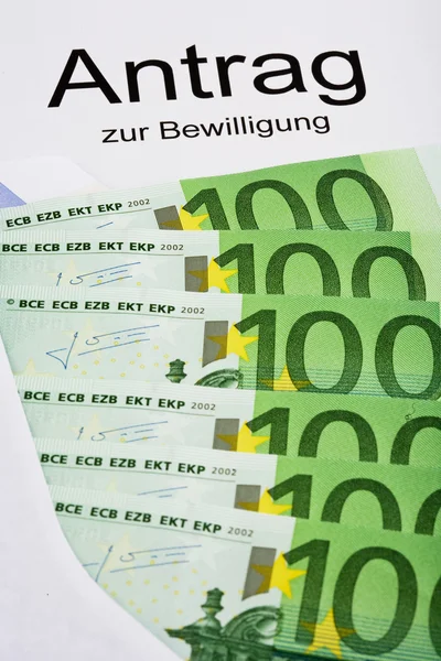 Billetes en euros y aplicación —  Fotos de Stock