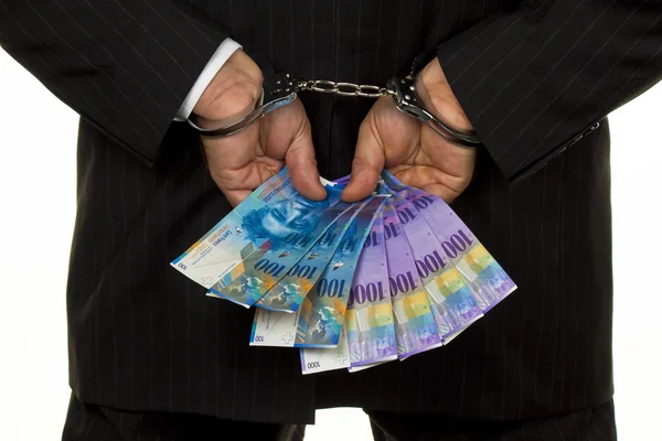 stock image Handcuffs and swiss francs