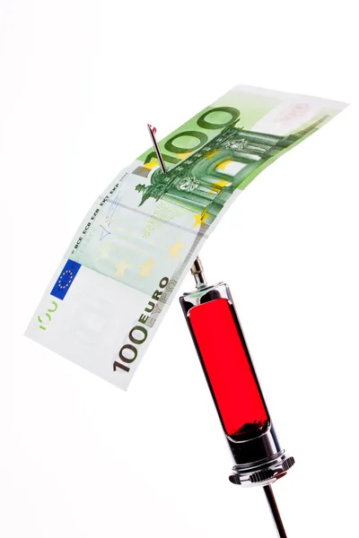 Ін'єкційна голка та шприц з євро . — стокове фото