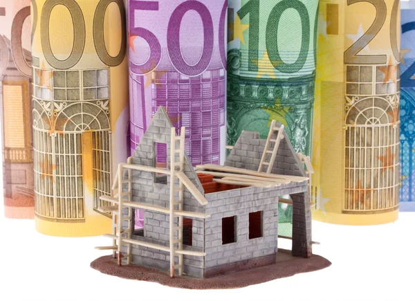Moneta in euro e banconote in franco svizzero — Foto Stock