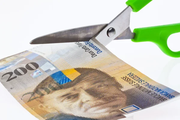 Swiss franc and scissors — Stock Photo, Image