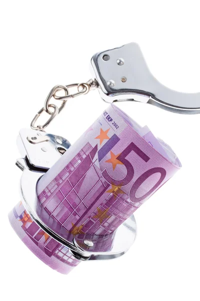 Банкнота евро с наручниками — стоковое фото