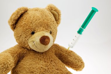 Teddy bear with injection clipart