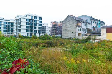 Vacant lot between two houses clipart