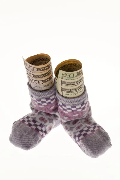 Детские носки с долларовой купюрой — стоковое фото
