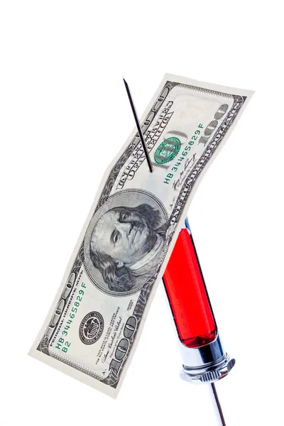 Injection needle and syringe with a dollar bill — Stock Photo, Image