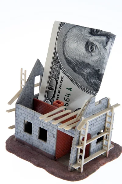 Carcass home. funding with dollar bills — Stock Photo, Image