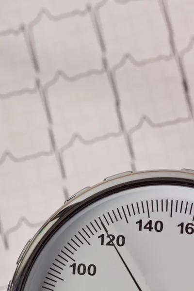 Blood pressure measurement and ecg curve — Stock Photo, Image