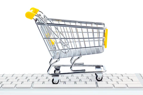 Cart and keyboard. online shopping — Stock Photo, Image