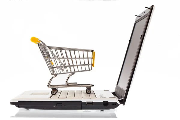 Carrinhos de compras e teclado do computador — Fotografia de Stock