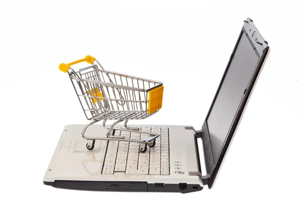 Carrinhos de compras e teclado do computador — Fotografia de Stock