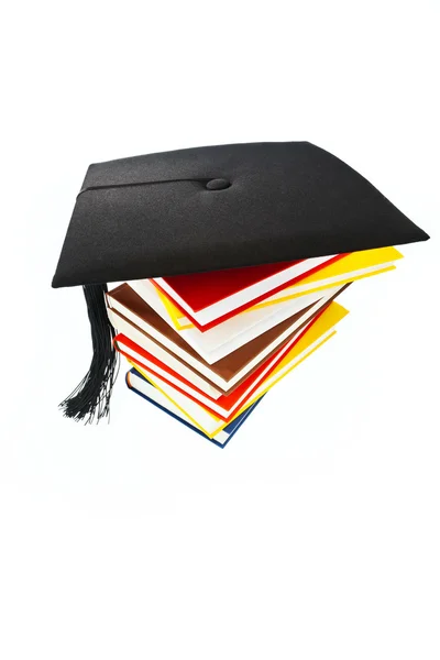 Mortarboard on a book stack — Stock Photo, Image