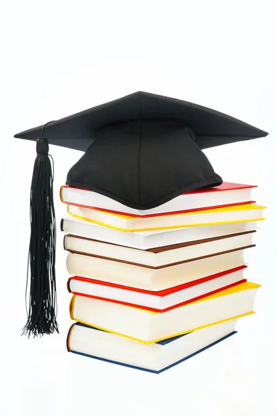 stock image Mortarboard on a book stack