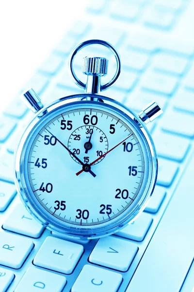 Stopwatch and computer keyboard — Stock Photo, Image