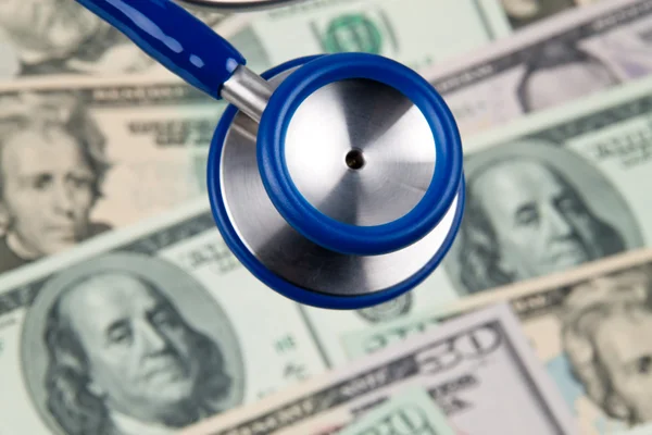 Dollar currency notes and stethoscope — Stock Photo, Image