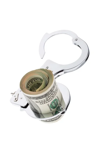 Банкноты долларов США с наручниками — стоковое фото