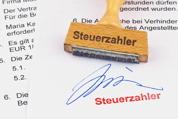Wooden stamp on the document: taxpayer — Stock Photo, Image