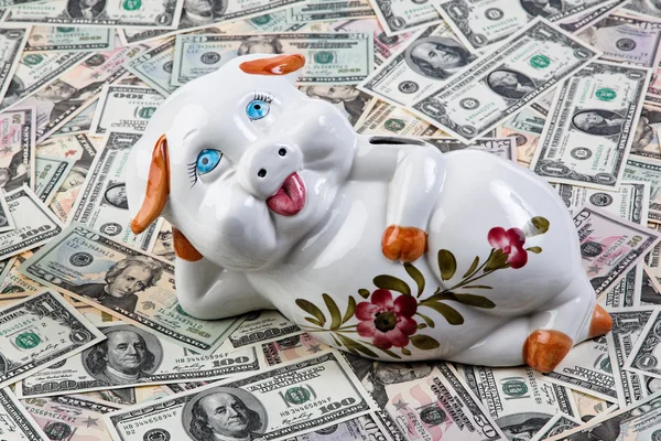 Dollar notes and piggy bank Stock Photo