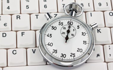 Stopwatch on computer keyboard clipart