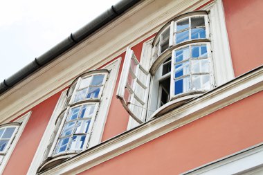 Old window in an old house clipart