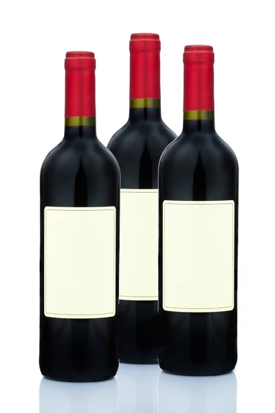 Красное вино в бутылках вина — стоковое фото
