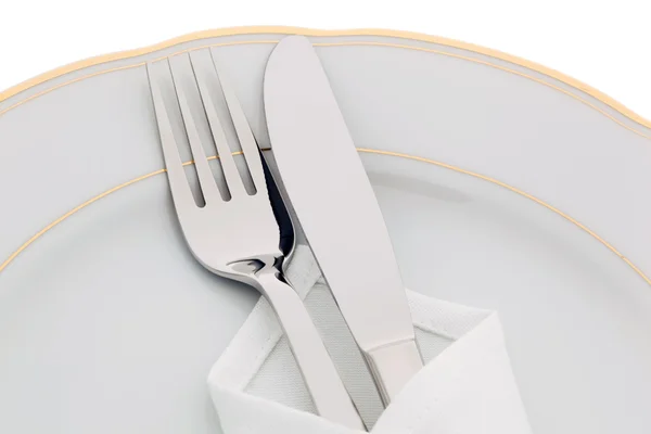 Ножи, вилки и тарелки — стоковое фото