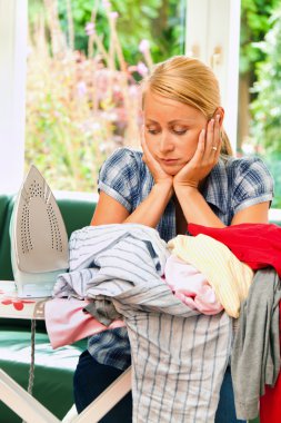 Housewife ironing with irons clipart