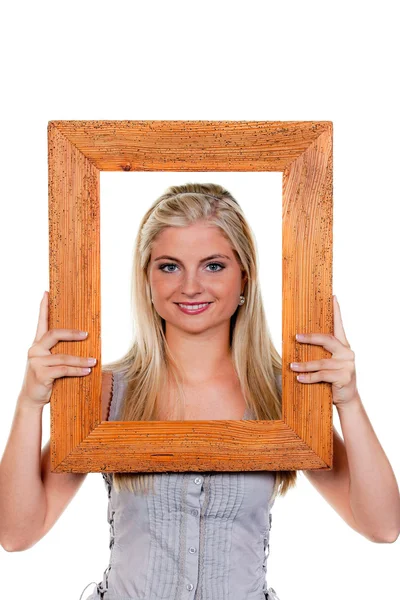 Жінка дивиться через рамку зображення — стокове фото