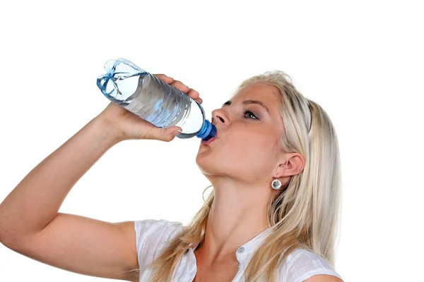 Woman is thirsty and drinking mineral water — Stock Photo, Image