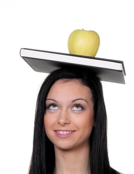 Estudante com maçã e livros sobre aprendizagem — Fotografia de Stock