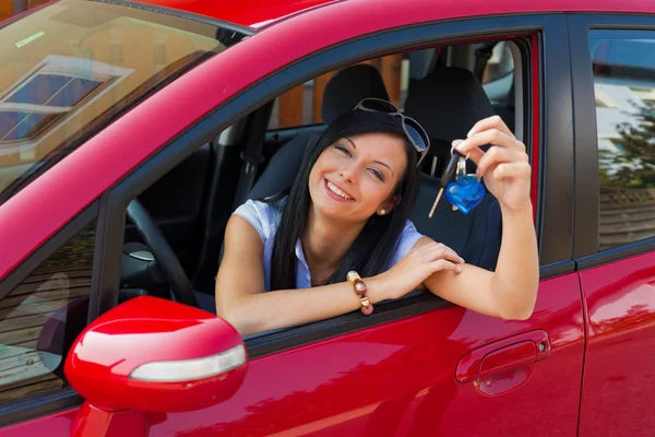 Young woman in the car with ingition — Stock Photo, Image