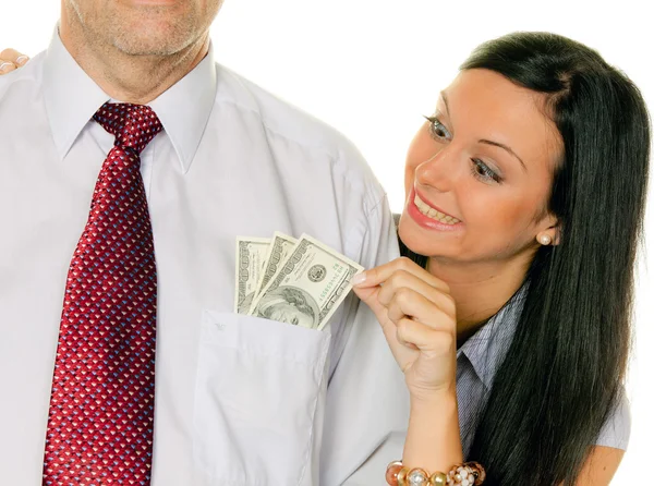 Una donna tira fuori un uomo dalla sua tasca soldi , — Foto Stock