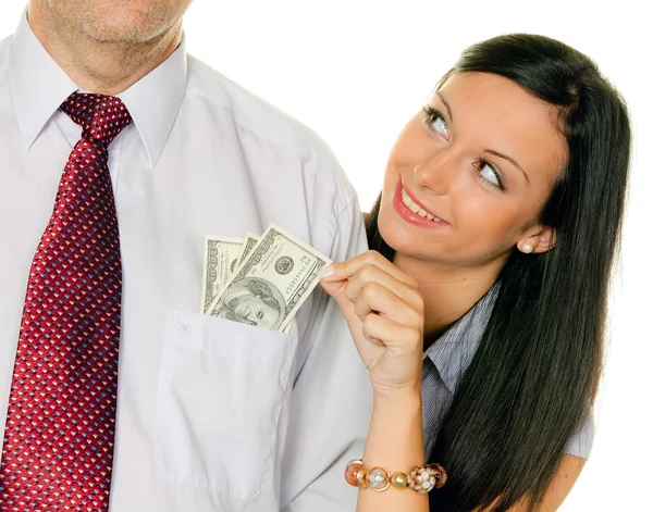 Woman pulls a man out of his pocket money, — Stock Photo, Image