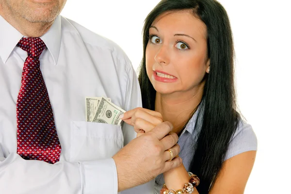 Жінка витягує чоловіка з кишенькових грошей , — стокове фото