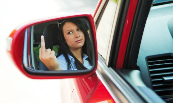 Angry woman driving the car when — Stock Photo, Image
