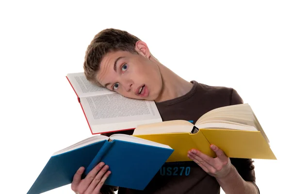 Um jovem estudante quando aprende com livros — Fotografia de Stock