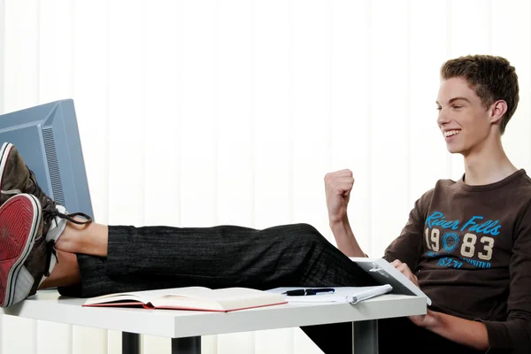 Young man with a computer — Stock Photo, Image