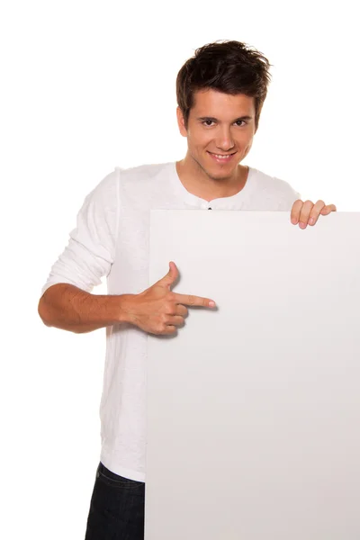 Man with empty poster to advertise — Stock Photo, Image