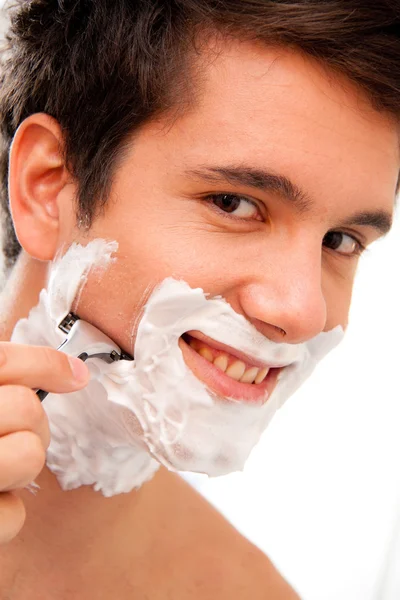 stock image Man shaves with a razor blade